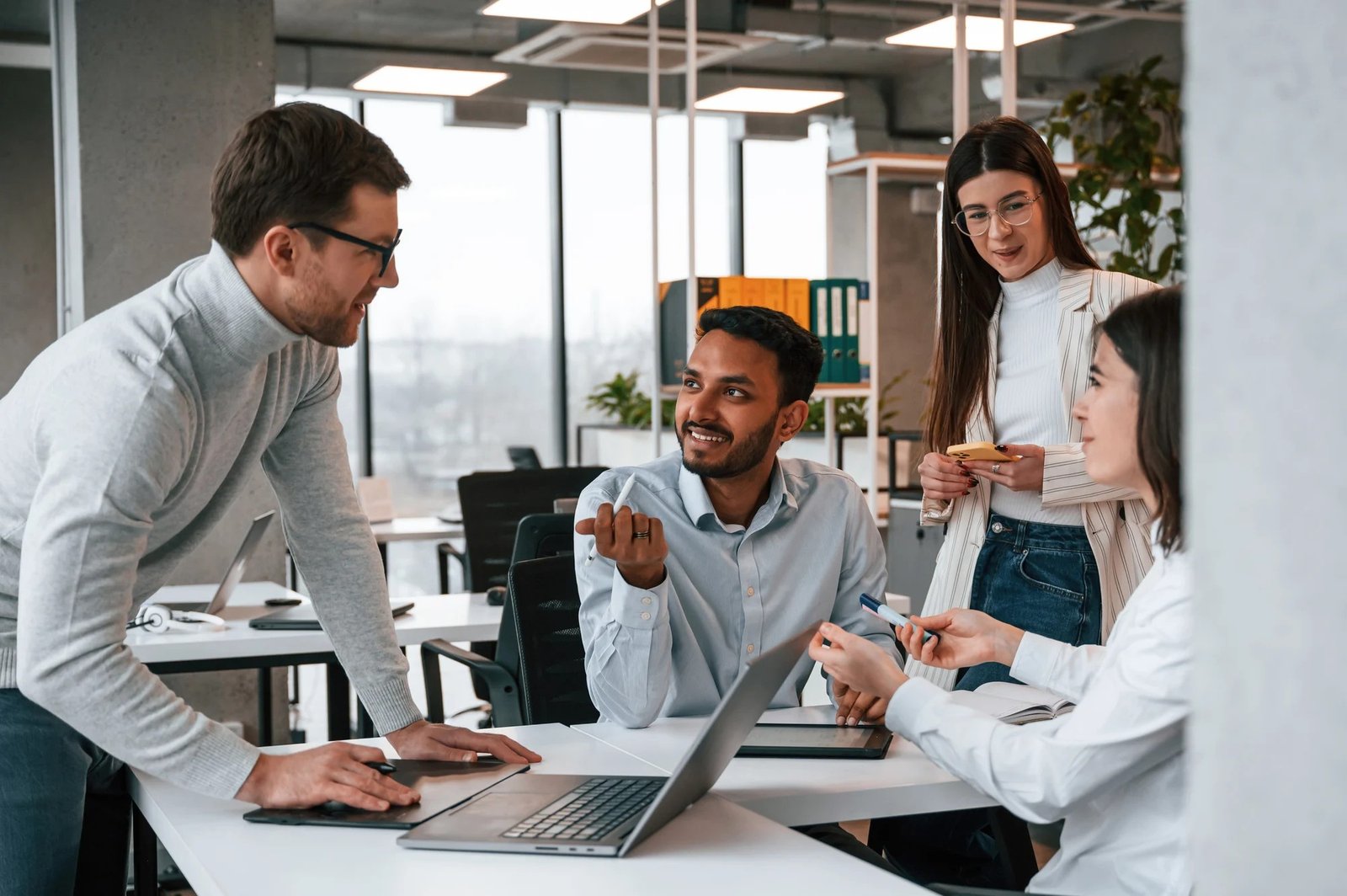 four-people-are-working-office-together